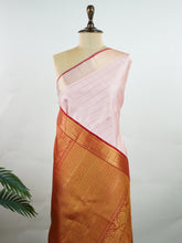 Kanchipuram Silk This red and gold Kanchipuram saree features bold buttis, rich 2G zari, and a majestic large border that wraps the wearer in splendour. #Manoranjitham #ButtiSaree #RedGoldSilk #2GZariWeaves #BridalSaree Vishnumaya - Manoranjitham Weaves - Handloom Store