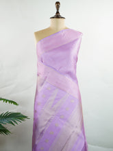 Kanchipuram Silk A rare lavender silk drape, adorned with traditional kattam checks and delicate buttas. The silver-gold zari glistens, casting a regal glow on this soft pastel beauty. Perfect for evening weddings where elegance speaks in hushed tones. An heirloom piece, woven with precision in the looms of Kanchipuram. #LavenderKanjivaram #KattamChecks #PureZari #HeritageSilks Shubhapantuvarali - Manoranjitham Weaves - Handloom Store