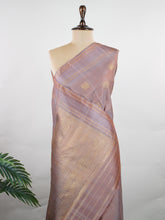 Kanchipuram Silk Earthy elegance meets intricate artistry in this light brown Kanjivaram. Oosikattam patterns and tiny buttas add texture to the soft sheen of silk. Ideal for cultural events and sacred celebrations. A classic drape for women who value understated heritage. #LightBrownSilk #OosikattamWeave #PureZari #HandloomBeauty Kedaragaula - Manoranjitham Weaves - Handloom Store
