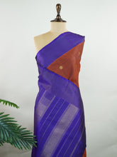 Kanchipuram Silk Rich brown silk meets regal purple in this Oosikattam masterpiece. The zari buttas sparkle subtly, adding festive warmth. Ideal for heritage celebrations and grand gatherings. A drape woven to command admiration. #BrownPurpleSilk #OosikattamDesign #PureZari #LuxuryTradition Suryakantham - Manoranjitham Weaves - Handloom Store