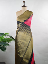 Kanchipuram Silk A stunning blend of vibrance and tradition, this magenta pink and mustard Kanjivaram saree is crafted in luxurious 100% pure silk. Adorned with elegant parrot buttis across the body, it beautifully reflects classic South Indian artistry. The bold contrast adds festive grandeur, making it a perfect pick for weddings and special celebrations. Karunamayi - Manoranjitham Weaves - Handloom Store