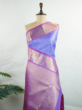 Kanchipuram Silk A masterpiece from Kanchipuram, this Kanjivaram saree in Royal Blue is a tribute to India's rich handloom legacy. The Pure Zari weaving and Buttis motifs make it a perfect choice for brides and celebrations. Every thread speaks of elegance, tradition, and the skilled hands that bring this saree to life. Bilaharia - Manoranjitham Weaves - Handloom Store