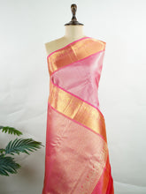 Kanchipuram Silk This 100% Pure Silk silk saree, adorned in Hot Pink and detailed with Pure Zari weaving, reflects the grandeur of Maharashtra. The timeless Buttis motifs enhance its bridal charm. A perfect blend of luxury and tradition, it is designed for those who appreciate fine craftsmanship. Bageshree - Manoranjitham Weaves - Handloom Store