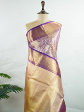 Kanchipuram Silk This 100% Pure Silk silk saree, adorned in Coral and detailed with Pure Zari weaving, reflects the grandeur of Maharashtra. The timeless Buttis motifs enhance its bridal charm. A perfect blend of luxury and tradition, it is designed for those who appreciate fine craftsmanship. Bhupali - Manoranjitham Weaves - Handloom Store
