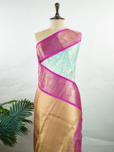 Kanchipuram Silk This 100% Pure Silk silk saree, adorned in Lilac and detailed with Pure Zari weaving, reflects the grandeur of Maharashtra. The timeless Buttis motifs enhance its bridal charm. A perfect blend of luxury and tradition, it is designed for those who appreciate fine craftsmanship. Gorakh - Manoranjitham Weaves - Handloom Store
