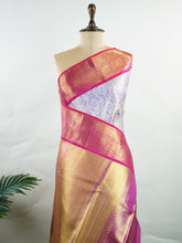 Kanchipuram Silk Handwoven by skilled artisans of Maharashtra, this 100% Pure Silk saree in Lilac blends traditional elegance with intricate Pure Zari zari work. A truly stunning drape for special occasions. The interplay of colors and craftsmanship makes it a treasured piece for every saree connoisseur. Patdeepa - Manoranjitham Weaves - Handloom Store