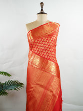 Kanchipuram Silk A radiant red Kanchipuram silk, embellished with delicate gold zari buttas across its expanse. The self-border adds understated grace, perfect for bridal elegance and festive occasions. This timeless weave reflects the grandeur of South Indian handloom heritage. #ManoranjithamSilks #KanjivaramHandloom #PureSilkSaree #BridalElegance #TimelessTradition Harikambhoji - Manoranjitham Weaves - Handloom Store