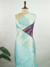 Kanchipuram Silk A regal burgundy Kanchipuram silk saree, woven from 100% pure silk with shimmering gold zari buttas adorning its body. The striking cyan border adds a vibrant contrast, making this drape perfect for grand occasions. Every weave echoes timeless tradition and handloom excellence. The rich hues speak of royal heritage, while the intricate zari work whispers stories of artisanal mastery. A timeless piece, crafted to grace your most cherished moments. #ManoranjithamSilks #KanjivaramHand