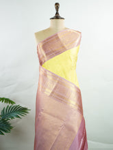 Kanchipuram Silk A radiant yellow Kanchipuram silk saree embellished with gold zari buttas, capturing the warmth of sunlight in every weave. The pink border adds a playful contrast, making it perfect for auspicious celebrations. Crafted from 100% pure silk, this handloom treasure carries the essence of timeless tradition. A saree designed to grace festive moments and bridal occasions. #ManoranjithamSilks #KanjivaramHandloom #PureSilkSaree #BridalElegance #TimelessTradition Sarasangi - Manoranjitham Wea
