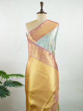 Kanchipuram Silk Earthy olive green silk paired with red borders, woven with gold and silver zari buttas that glimmer softly. This saree blends tradition with understated elegance. Made from 100% pure silk, it speaks of timeless beauty. A perfect drape for weddings and special occasions. #ManoranjithamSilks #KanjivaramHandloom #PureSilkSaree #BridalElegance #TimelessTradition Gowrimanohari - Manoranjitham Weaves - Handloom Store