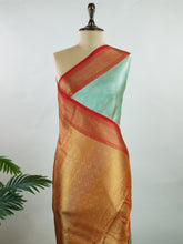 Kanchipuram Silk A rich green silk saree with bold red borders, adorned with gold and silver zari buttas that glimmer across the weave. The classic contrast reflects timeless tradition. Woven in Kanchipuram with 100% pure silk, it's perfect for weddings and special occasions. A drape that embodies heritage and grace. #ManoranjithamSilks #KanjivaramHandloom #PureSilkSaree #BridalElegance #TimelessTradition Gowla - Manoranjitham Weaves - Handloom Store