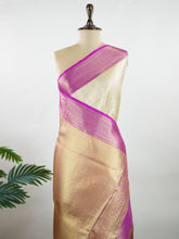Kanchipuram Silk A radiant golden silk saree with pink borders, woven with gold and silver zari buttas that shimmer with every fold. The vibrant hues bring festive charm to timeless tradition. Handwoven in Kanchipuram with 100% pure silk, it's perfect for weddings and special occasions. A drape that celebrates elegance and heritage. #ManoranjithamSilks #KanjivaramHandloom #PureSilkSaree #BridalElegance #TimelessTradition Sivaranjani - Manoranjitham Weaves - Handloom Store