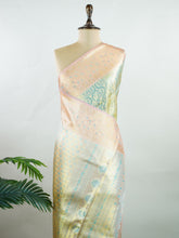 Kanchipuram Silk A refreshing green silk saree with light orange borders, adorned with gold and silver zari buttas that shimmer in gentle elegance. The vibrant contrast blends festive beauty with timeless tradition. Handwoven in Kanchipuram with 100% pure silk, it's perfect for weddings and special occasions. A drape that carries grace across generations. #ManoranjithamSilks #KanjivaramHandloom #PureSilkSaree #BridalElegance #TimelessTradition Niroshtaa - Manoranjitham Weaves - Handloom Store