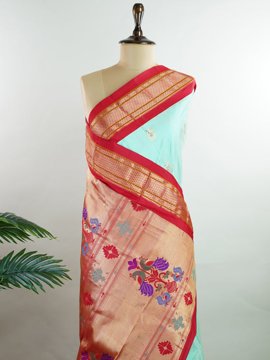 Narayanpet Narayanpet sarees feature elegant plain bodies adorned with delicate buttas, complemented by rich Paithani-style pallus.
These sarees beautifully combine simplicity and tradition, showcasing the perfect harmony of Narayanpet weaving and Paithani artistry. Bhairavi - Manoranjitham Weaves - Handloom Store