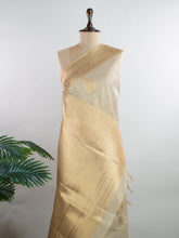 tissue This Kora Semi Tissue saree in rich gold features elegant stripes woven with fine zari. Lightweight and luminous, it captures the essence of festive finesse. Crafted in Varanasi, it drapes with ease and radiance. A timeless choice for celebrations with subtle grandeur. #KoraSemiTissue #GoldStripes #FineZari #VaranasiWeaves #ManoranjithamSarees Supriya - Manoranjitham Weaves - Handloom Store