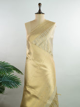 tissue This Kora Semi Tissue saree in rich gold features elegant stripes woven with fine zari. Lightweight and luminous, it captures the essence of festive finesse. Crafted in Varanasi, it drapes with ease and radiance. A timeless choice for celebrations with subtle grandeur. #KoraSemiTissue #GoldStripes #FineZari #VaranasiWeaves #ManoranjithamSarees Rajashree - Manoranjitham Weaves - Handloom Store