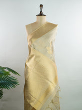 tissue This Kora Semi Tissue saree in rich gold features elegant stripes woven with fine zari. Lightweight and luminous, it captures the essence of festive finesse. Crafted in Varanasi, it drapes with ease and radiance. A timeless choice for celebrations with subtle grandeur. #KoraSemiTissue #GoldStripes #FineZari #VaranasiWeaves #ManoranjithamSarees Ishwarya - Manoranjitham Weaves - Handloom Store