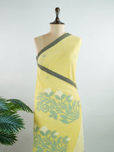 Cotton Woven with care in the looms of West Bengal, this 100% pure cotton saree blends everyday comfort with understated elegance. Fine zari floral designs shimmer softly against the breathable fabric, while the small border adds a touch of refinement. Lightweight and timeless, it’s perfect for summer gatherings and quiet celebrations Shubhapantuvarali - Manoranjitham Weaves - Handloom Store