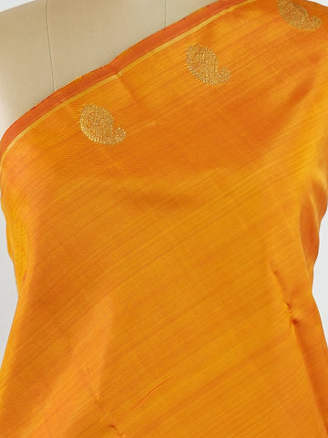 Kanchipuram Silk A bold classic in 100% pure silk, this Kanchipuram weave is a celebration of grace in its plain, glowing form. The vibrant body, paired with subtle gold zari, creates a quiet sophistication without the need for borders. Handwoven with devotion, it honours the legacy of bridal silks with contemporary elegance. An heirloom-worthy drape from Manoranjitham’s borderless Kanjivaram series. #KanchipuramSilk #Manoranjitham #PureZari #HandloomLuxury #TimelessElegance Padmakshi - Manoranjitham Weaves