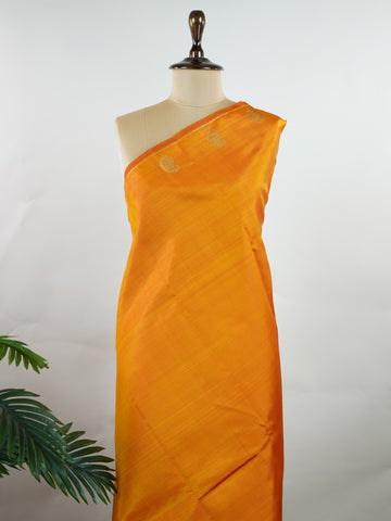 Kanchipuram Silk A bold classic in 100% pure silk, this Kanchipuram weave is a celebration of grace in its plain, glowing form. The vibrant body, paired with subtle gold zari, creates a quiet sophistication without the need for borders. Handwoven with devotion, it honours the legacy of bridal silks with contemporary elegance. An heirloom-worthy drape from Manoranjitham’s borderless Kanjivaram series. #KanchipuramSilk #Manoranjitham #PureZari #HandloomLuxury #TimelessElegance Padmakshi - Manoranjitham Weaves