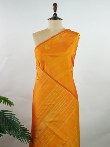 Kanchipuram Silk A bold classic in 100% pure silk, this Kanchipuram weave is a celebration of grace in its plain, glowing form. The vibrant body, paired with subtle gold zari, creates a quiet sophistication without the need for borders. Handwoven with devotion, it honours the legacy of bridal silks with contemporary elegance. An heirloom-worthy drape from Manoranjitham’s borderless Kanjivaram series. #KanchipuramSilk #Manoranjitham #PureZari #HandloomLuxury #TimelessElegance Padmakshi - Manoranjitham Weaves