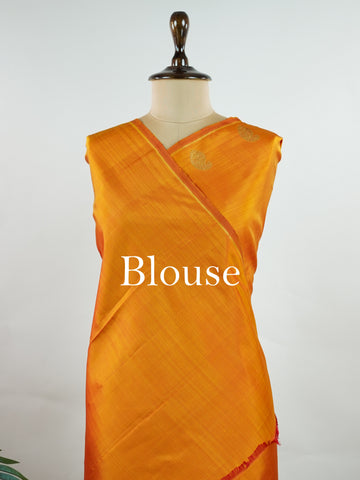 Kanchipuram Silk A bold classic in 100% pure silk, this Kanchipuram weave is a celebration of grace in its plain, glowing form. The vibrant body, paired with subtle gold zari, creates a quiet sophistication without the need for borders. Handwoven with devotion, it honours the legacy of bridal silks with contemporary elegance. An heirloom-worthy drape from Manoranjitham’s borderless Kanjivaram series. #KanchipuramSilk #Manoranjitham #PureZari #HandloomLuxury #TimelessElegance Padmakshi - Manoranjitham Weaves
