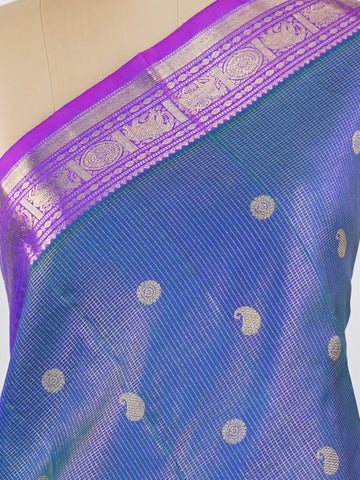Kanchipuram Silk A bright blue saree in pure silk with pink accents, this Kanchipuram Oosikattam weave is completed with a medium border and pure zari shimmer. Traditional checks meet vibrant colours in this versatile festive drape. Handwoven with precision at Manoranjitham. #Manoranjitham #OosikattamSilk #KanjivaramTradition #ColourAndCraft #SilkWithSoul Saraswathi - Manoranjitham Weaves - Handloom Store