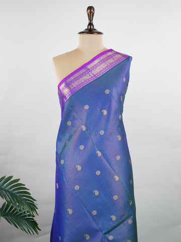 Kanchipuram Silk A bright blue saree in pure silk with pink accents, this Kanchipuram Oosikattam weave is completed with a medium border and pure zari shimmer. Traditional checks meet vibrant colours in this versatile festive drape. Handwoven with precision at Manoranjitham. #Manoranjitham #OosikattamSilk #KanjivaramTradition #ColourAndCraft #SilkWithSoul Saraswathi - Manoranjitham Weaves - Handloom Store