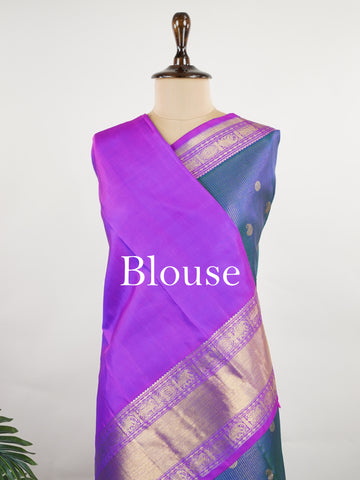 Kanchipuram Silk A bright blue saree in pure silk with pink accents, this Kanchipuram Oosikattam weave is completed with a medium border and pure zari shimmer. Traditional checks meet vibrant colours in this versatile festive drape. Handwoven with precision at Manoranjitham. #Manoranjitham #OosikattamSilk #KanjivaramTradition #ColourAndCraft #SilkWithSoul Saraswathi - Manoranjitham Weaves - Handloom Store
