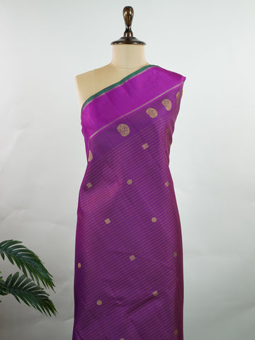 Kanchipuram Silk This magenta pink Oosikattam Kanchipuram saree in pure silk is a burst of vibrant tradition, woven with pure zari and framed with a classic medium border. Bold and joyful, it carries the strength of structure with a softness of hue. A beautiful pick for festive wear and bridal grace. #Manoranjitham #OosikattamWeave #MagentaSilk #HandloomHeritage #TimelessSarees Ambika - Manoranjitham Weaves - Handloom Store