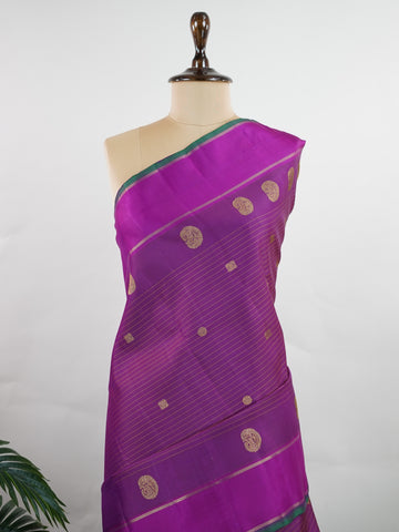Kanchipuram Silk This magenta pink Oosikattam Kanchipuram saree in pure silk is a burst of vibrant tradition, woven with pure zari and framed with a classic medium border. Bold and joyful, it carries the strength of structure with a softness of hue. A beautiful pick for festive wear and bridal grace. #Manoranjitham #OosikattamWeave #MagentaSilk #HandloomHeritage #TimelessSarees Ambika - Manoranjitham Weaves - Handloom Store