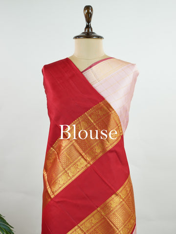 Kanchipuram Silk This red and gold Kanchipuram saree features bold buttis, rich 2G zari, and a majestic large border that wraps the wearer in splendour. #Manoranjitham #ButtiSaree #RedGoldSilk #2GZariWeaves #BridalSaree Vishnumaya - Manoranjitham Weaves - Handloom Store