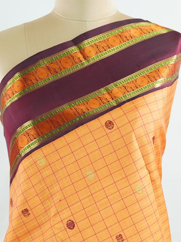 Kanchipuram Silk Orange and purple blend beautifully in this Kanchipuram saree with thread buttis and pure zari, offering medium-border elegance and festive vibrance. #Manoranjitham #ThreadButti #OrangePurpleSilk #KanjivaramCharm #HeritageInThreads Sattvika - Manoranjitham Weaves - Handloom Store