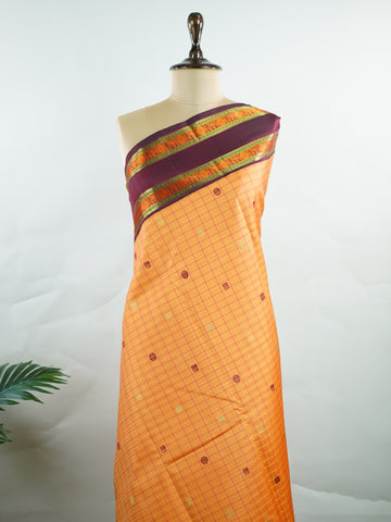 Kanchipuram Silk Orange and purple blend beautifully in this Kanchipuram saree with thread buttis and pure zari, offering medium-border elegance and festive vibrance. #Manoranjitham #ThreadButti #OrangePurpleSilk #KanjivaramCharm #HeritageInThreads Sattvika - Manoranjitham Weaves - Handloom Store