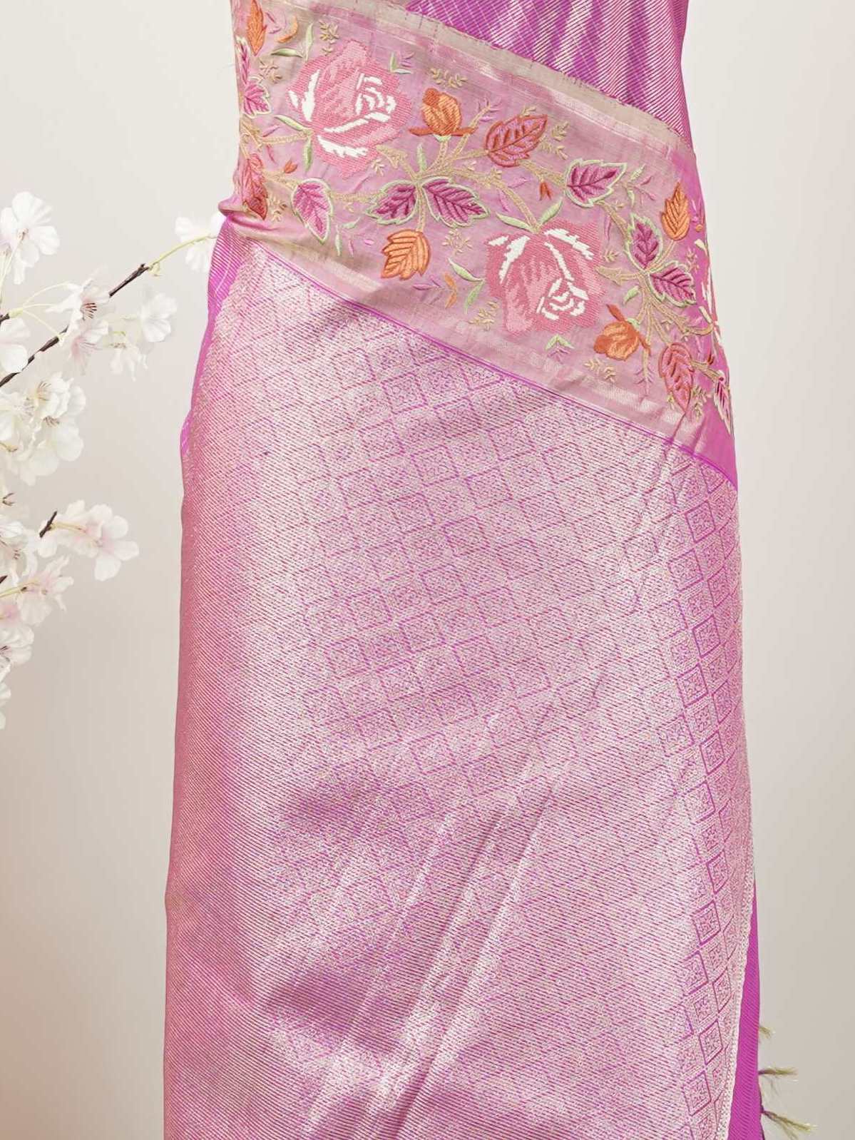 Kanchipuram Silk This opulent Kanjivaram silk saree glows with the richness of pure zari and the weight of tradition.br
Intricate Parsigara hand embroidery graces the borders and pallu, blending Tamil grandeur with Persian finesse.br
Each motif is a testament to time-honoured skill—luxury layered with legacy.br
A regal drape for weddings, heirloom moments, and celebrations of craftsmanship.br
#Manoranjitham #KanjivaramSilk #ParsigaraEmbroidery #HandloomLuxury #BridalSaree #HeirloomWeaves #TraditionMeetsEleg