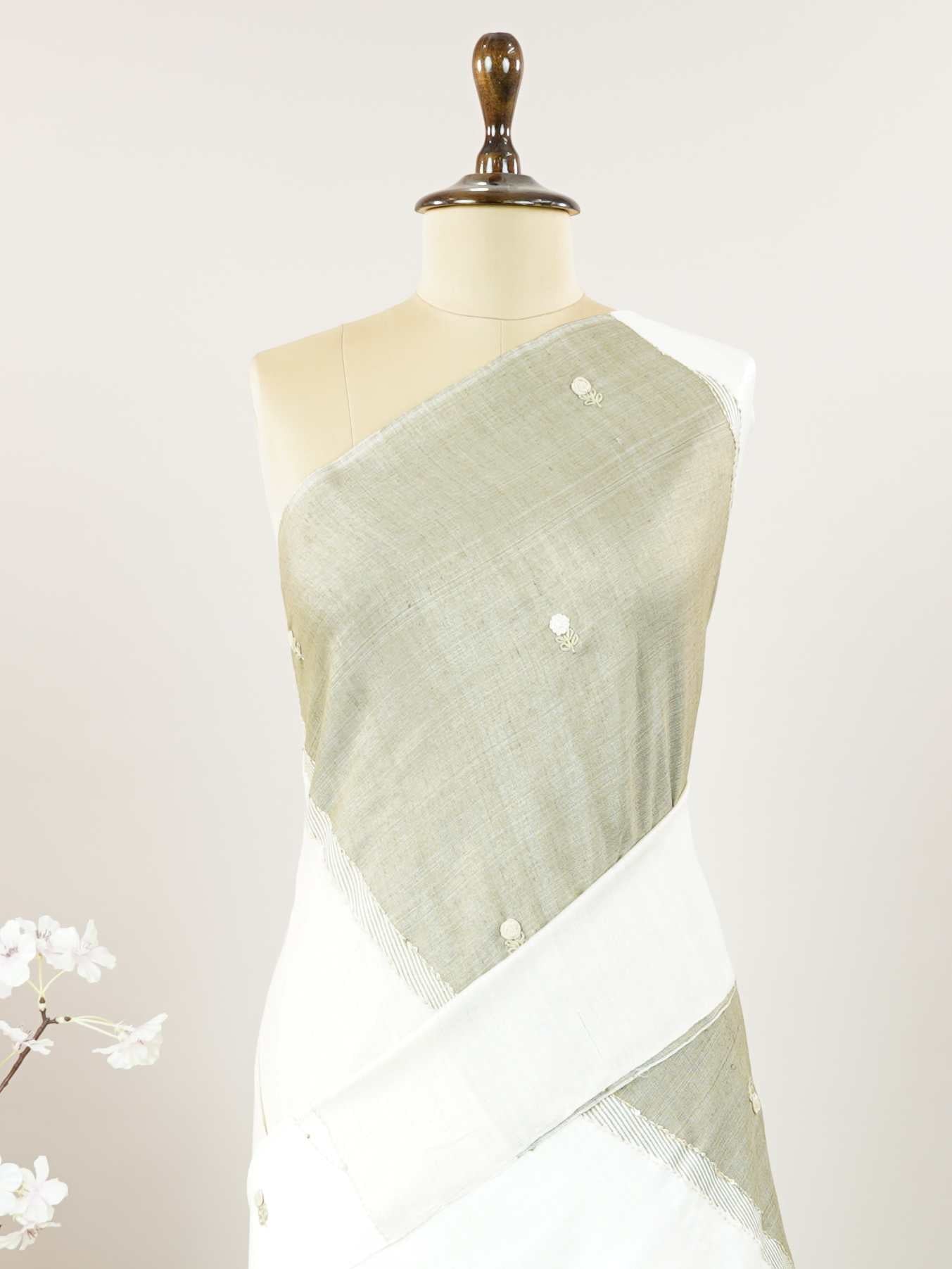 Tussar Woven from pure Tussar silk, this saree glows with its signature textured sheen and understated elegance. Fine hand embroidery dances across the body and border, adding gentle detail without overpowering the weave. The blend of earthy silk and intricate threadwork makes it perfect for both formal and festive wear.br
Graceful, grounded, and rich in quiet luxury.br
#Manoranjitham #TussarSilk #EmbroideredSaree #HandcraftedElegance #SubtleLuxury #ThreadedWithTradition #TextileStories Janani - Tussar Silk