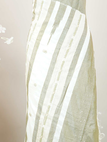 Tussar Woven from pure Tussar silk, this saree glows with its signature textured sheen and understated elegance. Fine hand embroidery dances across the body and border, adding gentle detail without overpowering the weave. The blend of earthy silk and intricate threadwork makes it perfect for both formal and festive wear.br
Graceful, grounded, and rich in quiet luxury.br
#Manoranjitham #TussarSilk #EmbroideredSaree #HandcraftedElegance #SubtleLuxury #ThreadedWithTradition #TextileStories Janani - Tussar Silk