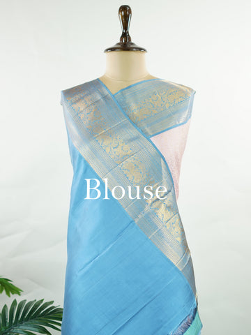 Kanchipuram Silk Beautiful bridal Kanjivaram saree featuring a charming Baby Pink body, beautifully contrasted with a graceful Pastel Blue border, pallu, and matching blouse. The delicate blend of Baby Pink and Pastel Blue creates a dreamy and elegant bridal palette with timeless appeal. Expertly woven with exquisite Kanjivaram craftsmanship, the saree radiates sophistication, grace, and refined luxury. A perfect choice for weddings and grand celebrations, this enchanting drape captures the essence of beaut