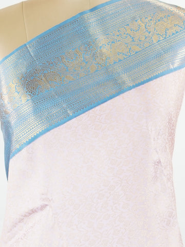 Kanchipuram Silk Beautiful bridal Kanjivaram saree featuring a charming Baby Pink body, beautifully contrasted with a graceful Pastel Blue border, pallu, and matching blouse. The delicate blend of Baby Pink and Pastel Blue creates a dreamy and elegant bridal palette with timeless appeal. Expertly woven with exquisite Kanjivaram craftsmanship, the saree radiates sophistication, grace, and refined luxury. A perfect choice for weddings and grand celebrations, this enchanting drape captures the essence of beaut
