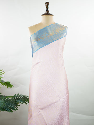 Kanchipuram Silk Beautiful bridal Kanjivaram saree featuring a charming Baby Pink body, beautifully contrasted with a graceful Pastel Blue border, pallu, and matching blouse. The delicate blend of Baby Pink and Pastel Blue creates a dreamy and elegant bridal palette with timeless appeal. Expertly woven with exquisite Kanjivaram craftsmanship, the saree radiates sophistication, grace, and refined luxury. A perfect choice for weddings and grand celebrations, this enchanting drape captures the essence of beaut