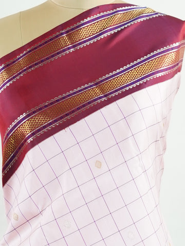 Kanchipuram Silk Radiant pink meets rich maroon in this pure silk Kanjivaram with bold kattan checks. The 2G zari borders glisten with grandeur, making it a favourite for festive occasions. Drapes with a majestic fall, creating a timeless bridal statement.
#PinkSilkSaree #KattanChecks #HandloomHeritage #BridalSilk #Manoranjitham Hamsadhwani - Manoranjitham Weaves - Handloom Store