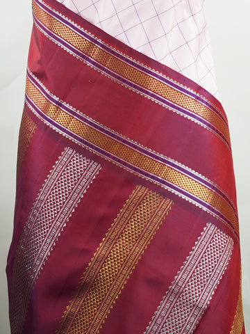 Kanchipuram Silk Radiant pink meets rich maroon in this pure silk Kanjivaram with bold kattan checks. The 2G zari borders glisten with grandeur, making it a favourite for festive occasions. Drapes with a majestic fall, creating a timeless bridal statement.
#PinkSilkSaree #KattanChecks #HandloomHeritage #BridalSilk #Manoranjitham Hamsadhwani - Manoranjitham Weaves - Handloom Store