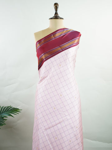 Kanchipuram Silk Radiant pink meets rich maroon in this pure silk Kanjivaram with bold kattan checks. The 2G zari borders glisten with grandeur, making it a favourite for festive occasions. Drapes with a majestic fall, creating a timeless bridal statement.
#PinkSilkSaree #KattanChecks #HandloomHeritage #BridalSilk #Manoranjitham Hamsadhwani - Manoranjitham Weaves - Handloom Store