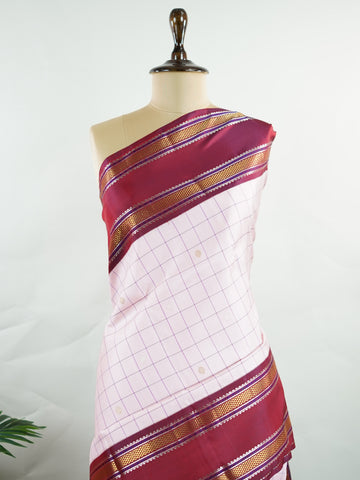 Kanchipuram Silk Radiant pink meets rich maroon in this pure silk Kanjivaram with bold kattan checks. The 2G zari borders glisten with grandeur, making it a favourite for festive occasions. Drapes with a majestic fall, creating a timeless bridal statement.
#PinkSilkSaree #KattanChecks #HandloomHeritage #BridalSilk #Manoranjitham Hamsadhwani - Manoranjitham Weaves - Handloom Store