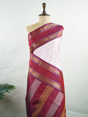 Kanchipuram Silk Radiant pink meets rich maroon in this pure silk Kanjivaram with bold kattan checks. The 2G zari borders glisten with grandeur, making it a favourite for festive occasions. Drapes with a majestic fall, creating a timeless bridal statement.
#PinkSilkSaree #KattanChecks #HandloomHeritage #BridalSilk #Manoranjitham Hamsadhwani - Manoranjitham Weaves - Handloom Store