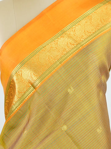 Kanchipuram Silk A rare Viraoosi pattern in lush green silk, brought alive with vibrant orange borders. The 2G zari adds a royal glimmer, making it perfect for traditional ceremonies. A true collector’s piece for those who value unique handloom artistry.
#ViraoosiSaree #GreenSilk #HandloomHeritage #PureSilkSaree #Manoranjitham Kamavardhini - Manoranjitham Weaves - Handloom Store