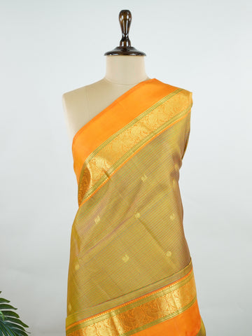 Kanchipuram Silk A rare Viraoosi pattern in lush green silk, brought alive with vibrant orange borders. The 2G zari adds a royal glimmer, making it perfect for traditional ceremonies. A true collector’s piece for those who value unique handloom artistry.
#ViraoosiSaree #GreenSilk #HandloomHeritage #PureSilkSaree #Manoranjitham Kamavardhini - Manoranjitham Weaves - Handloom Store