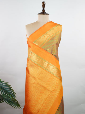 Kanchipuram Silk A rare Viraoosi pattern in lush green silk, brought alive with vibrant orange borders. The 2G zari adds a royal glimmer, making it perfect for traditional ceremonies. A true collector’s piece for those who value unique handloom artistry.
#ViraoosiSaree #GreenSilk #HandloomHeritage #PureSilkSaree #Manoranjitham Kamavardhini - Manoranjitham Weaves - Handloom Store