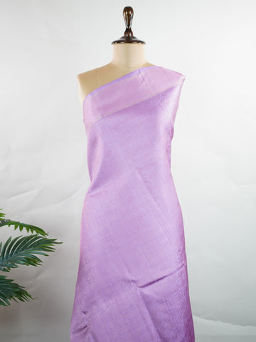 Kanchipuram Silk A rare lavender silk drape, adorned with traditional kattam checks and delicate buttas. The silver-gold zari glistens, casting a regal glow on this soft pastel beauty. Perfect for evening weddings where elegance speaks in hushed tones. An heirloom piece, woven with precision in the looms of Kanchipuram. #LavenderKanjivaram #KattamChecks #PureZari #HeritageSilks Shubhapantuvarali - Lavender Pure Kanjivaram Silk Saree | Woven Buttas - Manoranjitham Weaves - Handloom Store