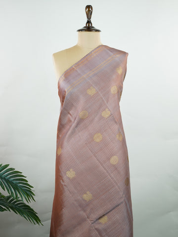 Kanchipuram Silk Earthy elegance meets intricate artistry in this light brown Kanjivaram. Oosikattam patterns and tiny buttas add texture to the soft sheen of silk. Ideal for cultural events and sacred celebrations. A classic drape for women who value understated heritage. #LightBrownSilk #OosikattamWeave #PureZari #HandloomBeauty Kedaragaula - Manoranjitham Weaves - Handloom Store